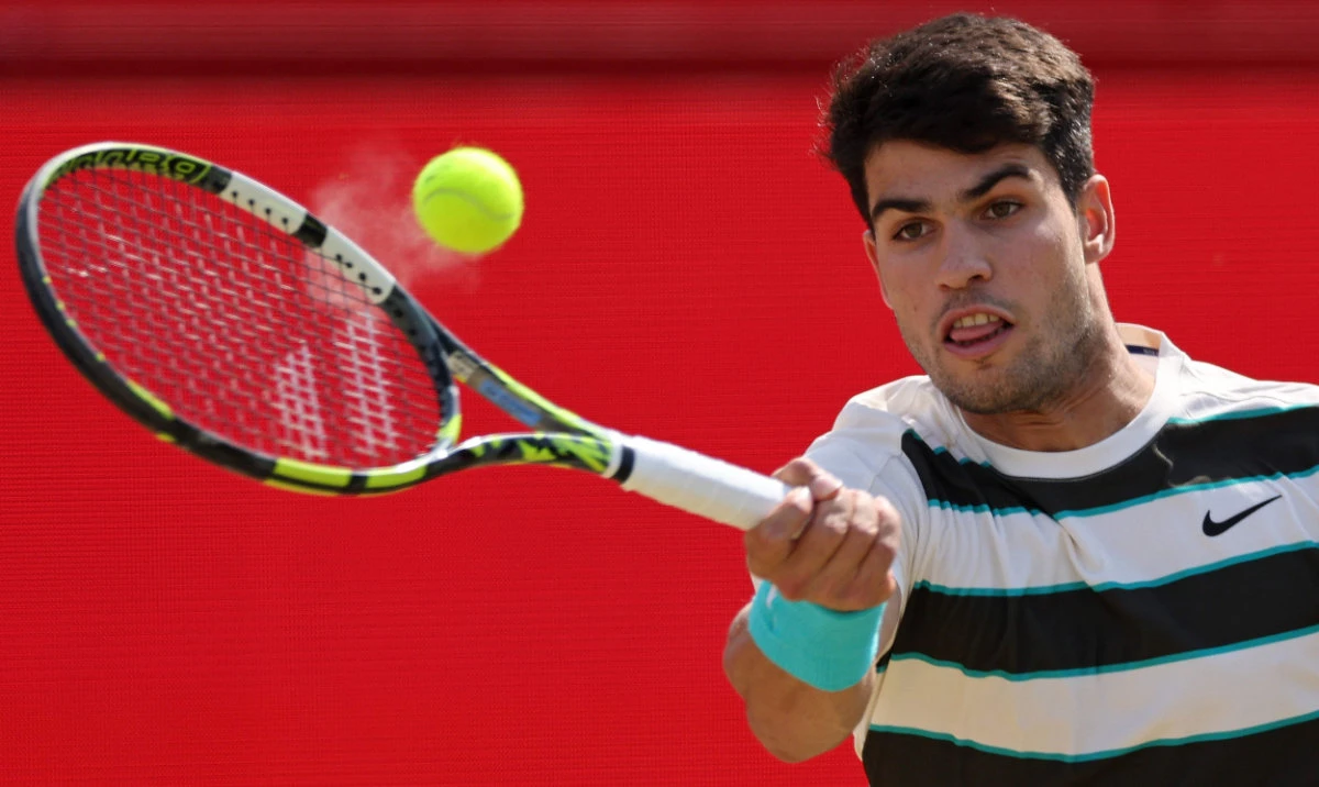 Spain’s Carlos Alcaraz returns against Australia’s Adam Walton during their men’s singles round of 32 tennis match at the HSBC ATP tennis Championships at Queen’s Club in west London on Tuesday. (AFP)