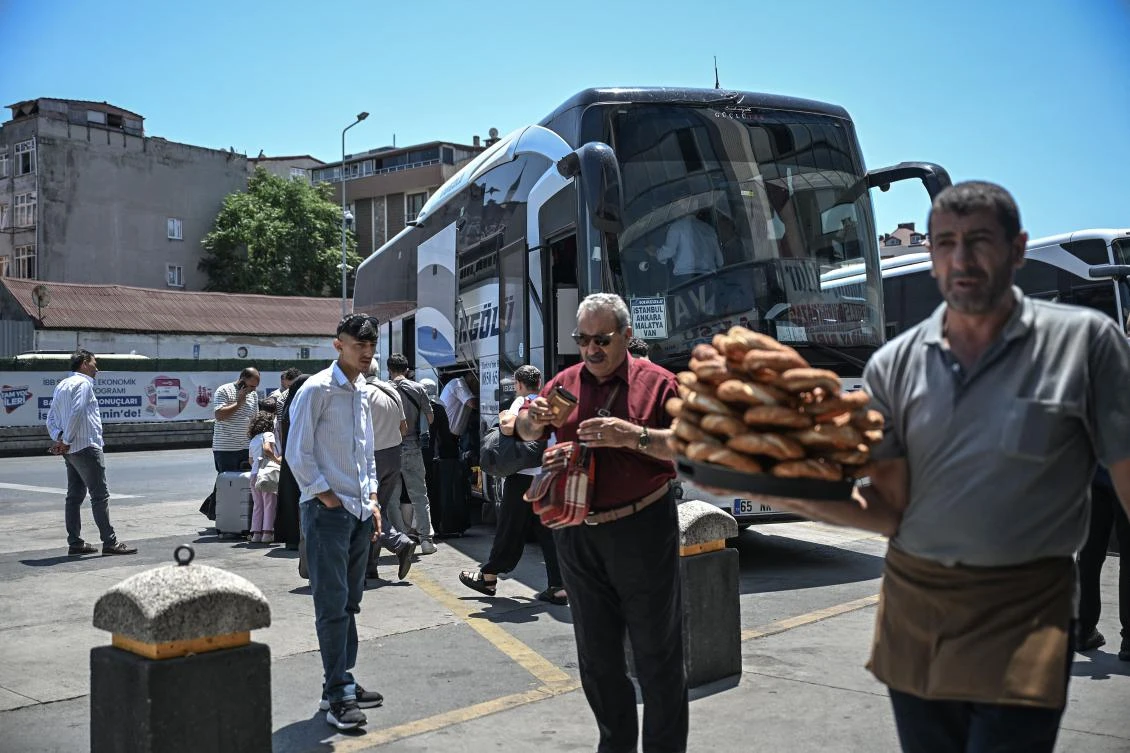 Mostly Iranian citizens board a bus traveling to Van, a city in eastern Turkiye near the border with Iran, at the Esenler bus terminal in Istanbul, on Jun. 18, 2025. (AFP)