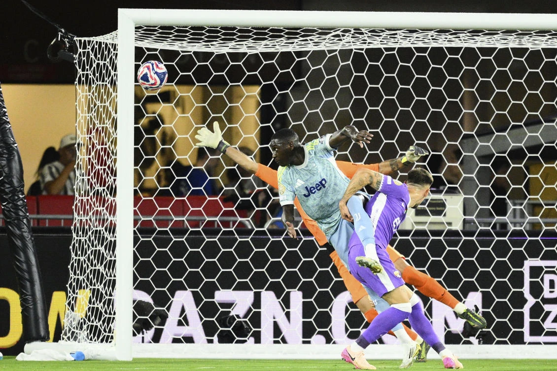 Juventus’ Randal Kolo Muani, top, heads the ball to score his team’s first goal during the Club World Cup group G match between Al-Ain and Juventus in Washington on June 18, 2025. (AP)