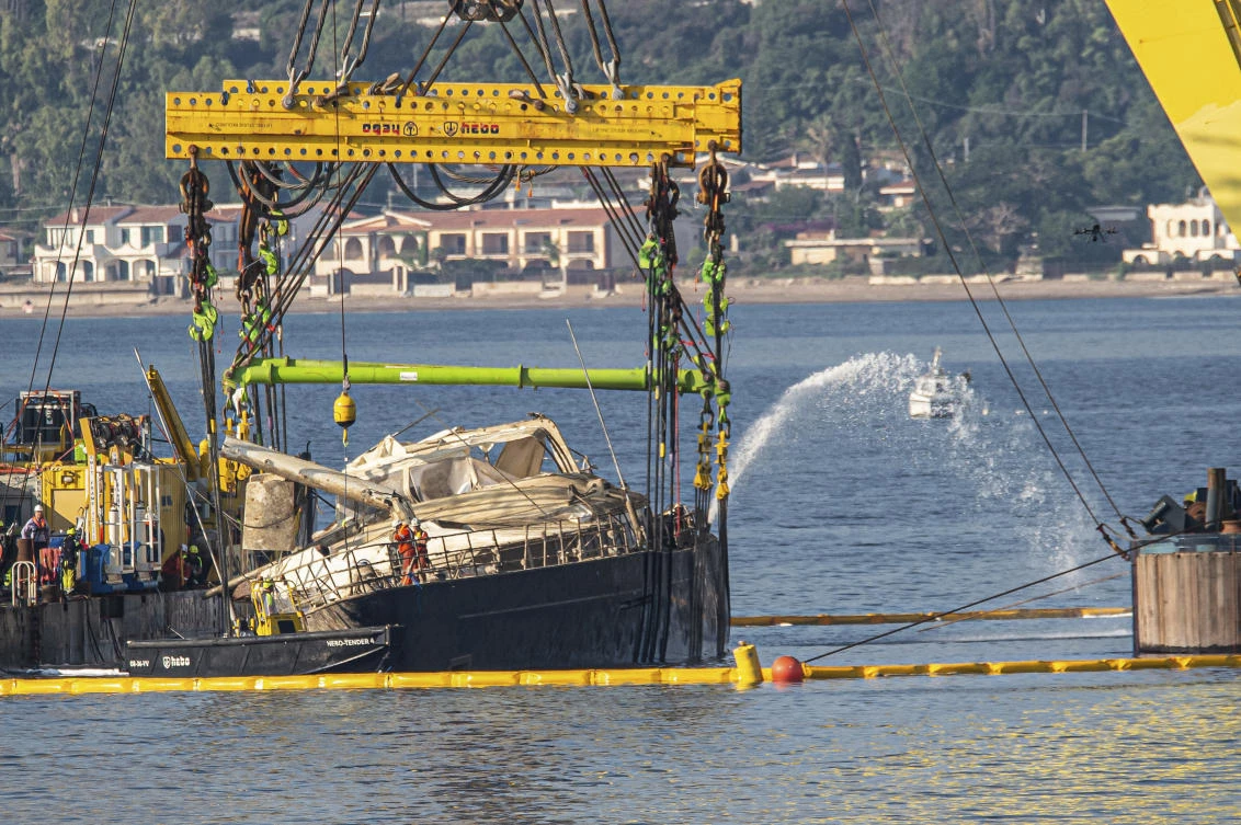Superyacht is pulled from the seabed 10 months after sinking off Sicily