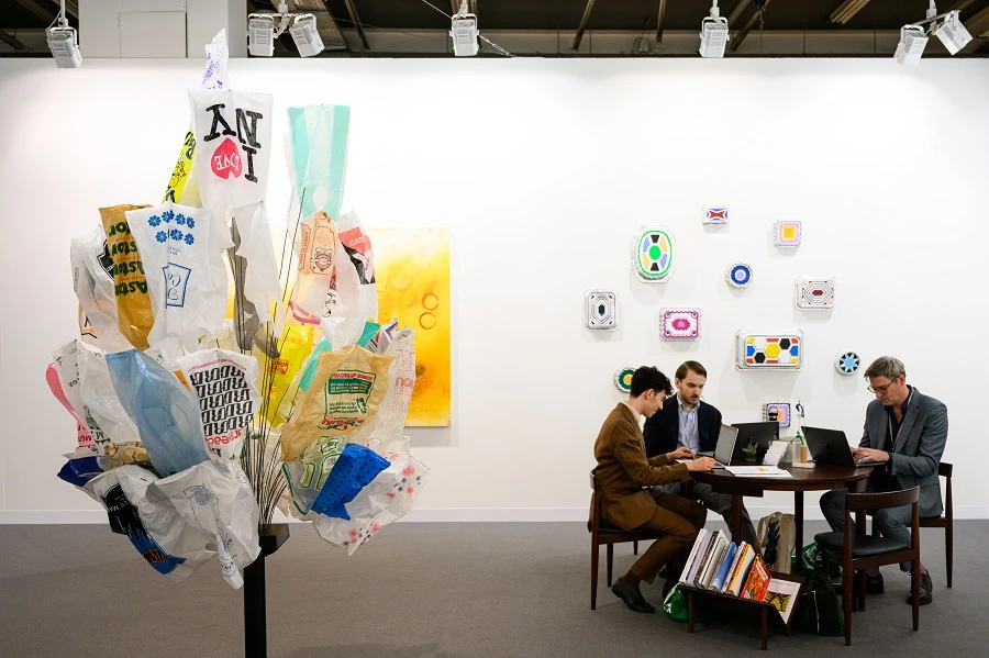Gallerists work next to artworks of B. Wurtz displayed at Art Basel at Messe Basel on June 18, 2025 in Basel, Switzerland. (Getty Images)