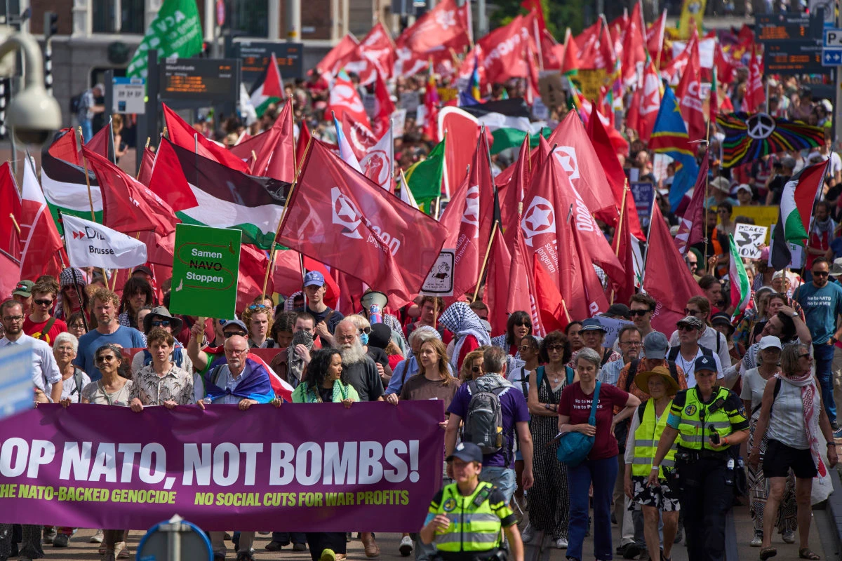 People carry banners and flags during a demonstration ahead of the NATO summit in The Hague, Netherlands, on June 22, 2025. (AP)