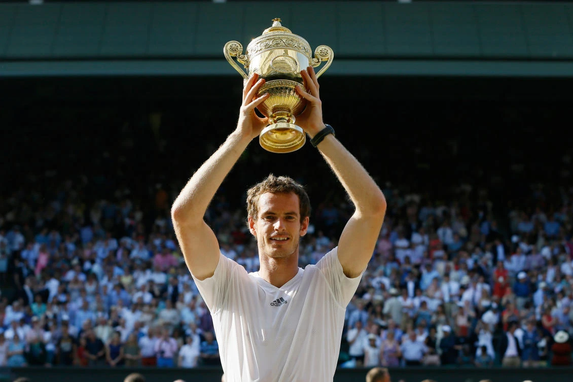 Andy Murray of Britain poses with the trophy after defeating Novak Djokovic of Serbia in the men’s singles final match at the All England Lawn Tennis Championships in Wimbledon, Jul. 7, 2013. (AP/File)