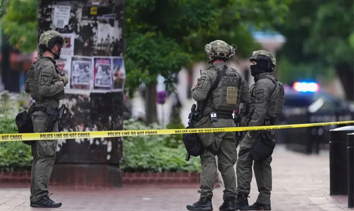 Law enforcement officials investigate after the attack in Boulder, Colorado. (AP)