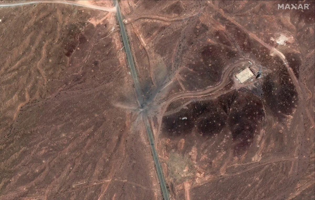 Satellite images from before Sunday’s attacks showed a long line of vehicles outside the Fordow plant. (MAXAR)
