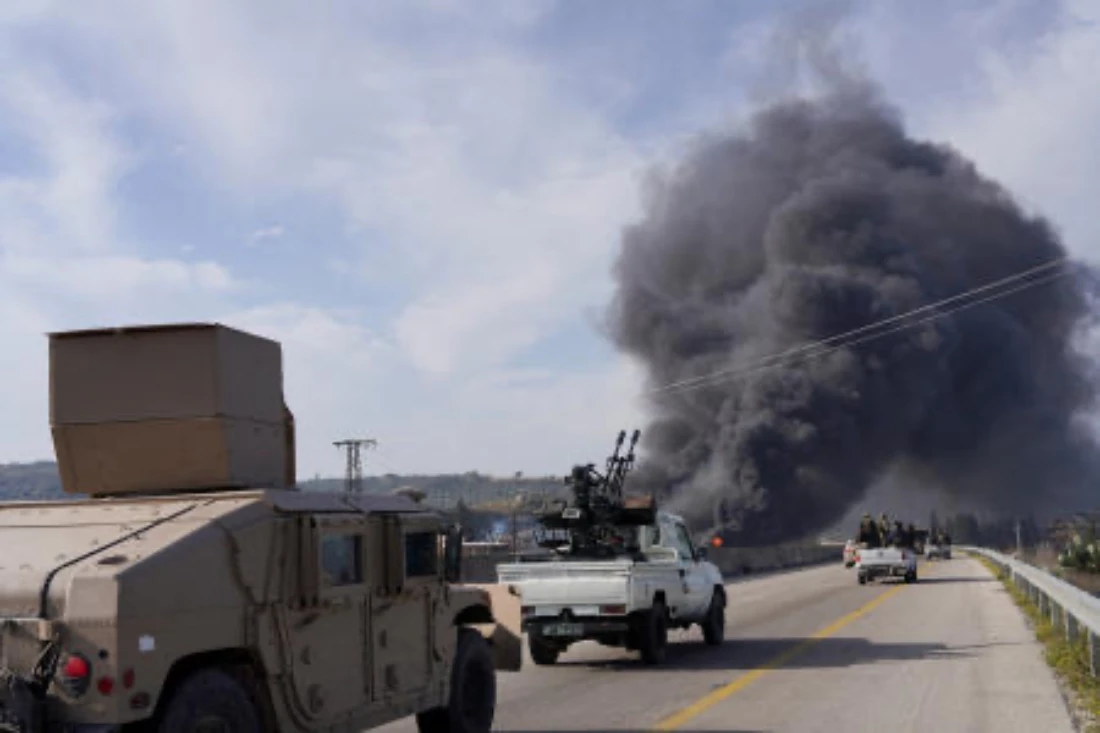 Members from the Syrian forces ride on a vehicle as they battle against an insurgency by fighters from ousted leader Bashar al Assad's Alawite sect, in Latakia, Syria. (Reuters)