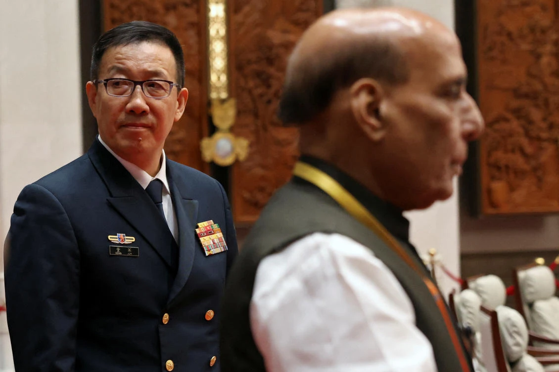 Chinese Defense Minister Dong Jun, left, and India’s Defense Minister Rajnath Singh visit a meeting hall at the Shanghai Cooperation Organization Defense Ministers’ Meeting in Qingdao, Shandong province, China on June 26, 2025. (Reuters)