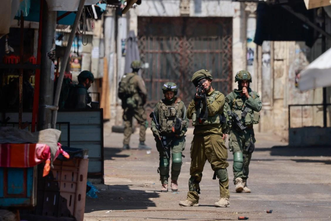 Israeli soldiers take aim during a raid in the old town of Nablus city in the occupied West Bank on June 10, 2025. (AFP)