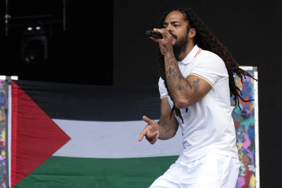 To the backdrop of a Palestinian flag, Bobby Vylan of British duo Bob Vylan performs on the West Holts Stage on the fourth day of the Glastonbury festival at Worthy Farm in the village of Pilton in Somerset, south-west England. (AFP)