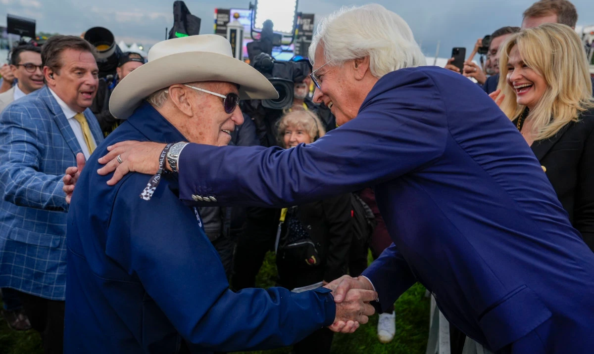 Seize The Grey’s trainer D. Wayne Lukas, left, shakes hands with with Bob Baffert, Imagination’s trainer, after Lukas' horse won the Preakness Stakes horse race at Pimlico Race Course, May 18, 2024, in Baltimore. (AP)