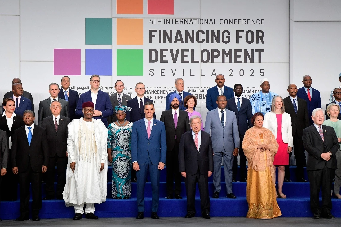Spanish Prime Minister Pedro Sanchez and UN Secretary General Antonio Guterres pose for a photo with the rest of heads of state and representatives attending the UN's 4th International Conference on Financing and Development in Seville, Spain. (AFP)