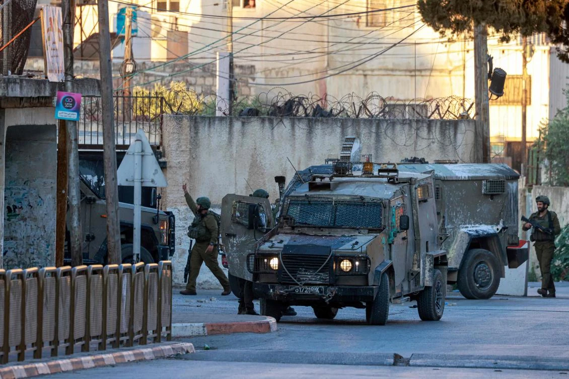 Israeli army forces deploy around the religious site of Joseph's Tomb in the occupied West Bank city of Nablus on June 27, 2025 after a group of Israelis entered the site without coordination with Palestinian security forces. (AFP)