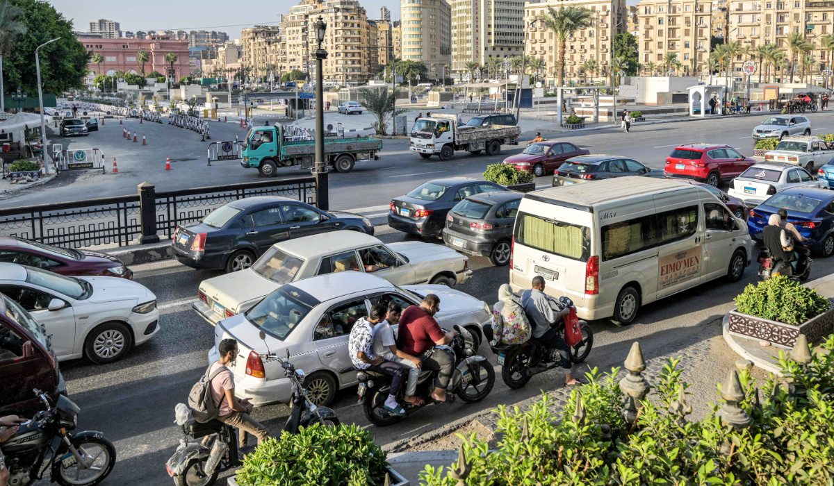 Motorists wait in traffic outside the Egyptian foreign ministry headquarters in Tahrir Palace in Cairo's central Tahrir Square on September 9, 2024. (AFP)