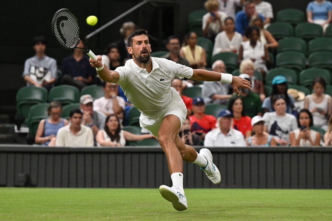 Serbia’s Novak Djokovic plays a forehand return to France’s Alexandre Muller during their men’s singles first round on the second day of the 2025 Wimbledon Championships at The All England Lawn Tennis and Croquet Club on Tuesday. (AFP)