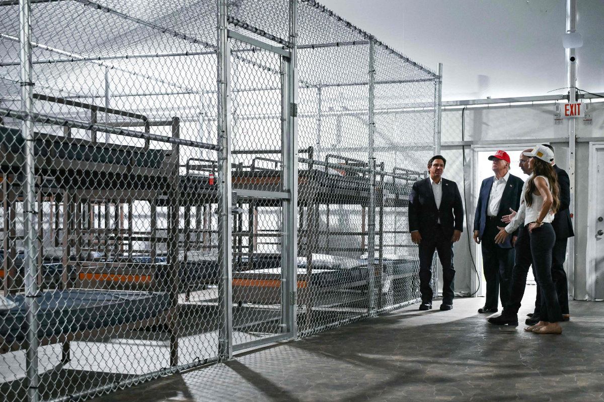 US President President Donald Trump (2L), Florida Governor Ron DeSantis (L), and Secretary of Homeland Security Kristi Noem (R) tour a migrant detention center, dubbed "Alligator Alcatraz," located at the site of the Dade-Collier Training and Transition Airport in Ochopee, Florida on July 1, 2025. (AFP)
