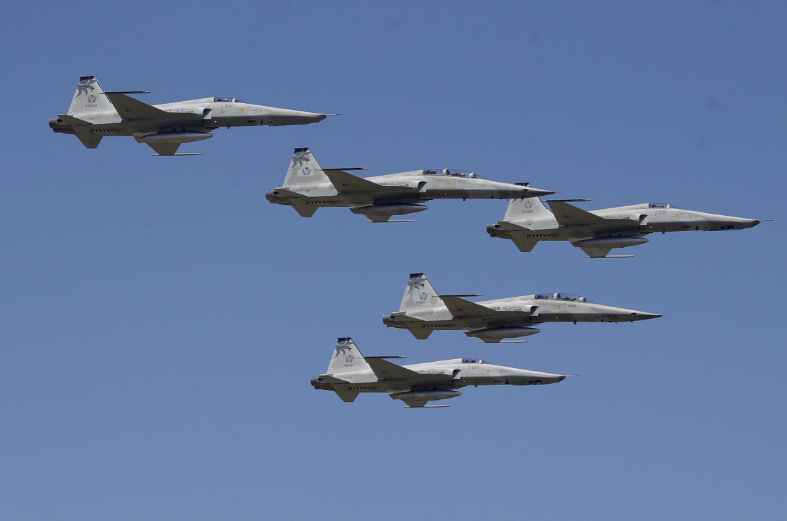 Three Taiwan’s RF-5E Tigergazer reconnaissance version fighters, Vietnam-era F-5 fighter jets, seen top, third from top and bottom, and two F-5F fighters fly during a retirement ceremony for RF-5E Tigergazer fighter jets at an air base in Hualien, eastern Taiwan, Friday, July 4, 2025. (AP)