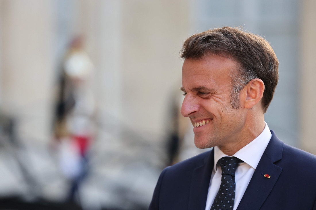 French President Emmanuel Macron smiles during a press statement in Paris. (AFP)