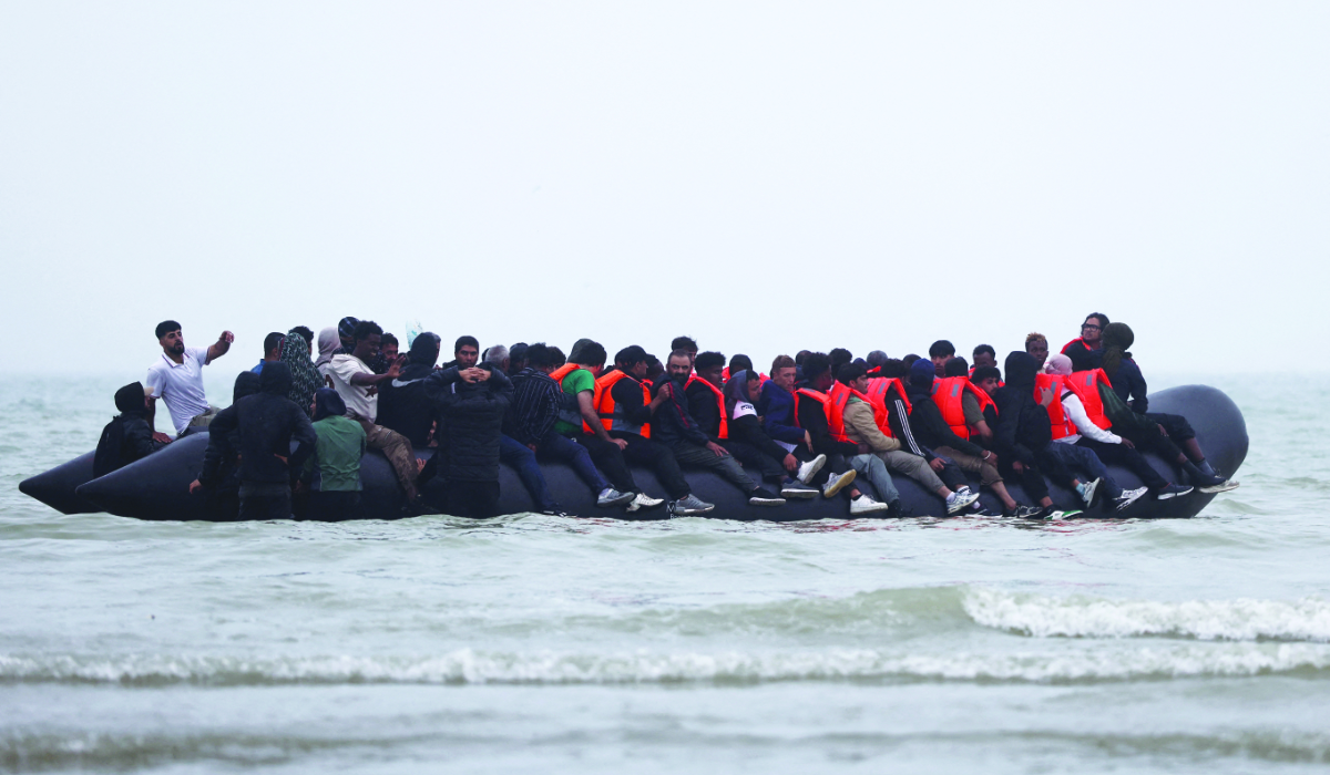 A group of migrants on an inflatable dinghy leave the coast of northern France in an attempt to cross the English Channel to reach Britain, from the beach of Petit-Fort-Philippe in Gravelines, near Calais, France, July 2, 2025. (REUTERS)