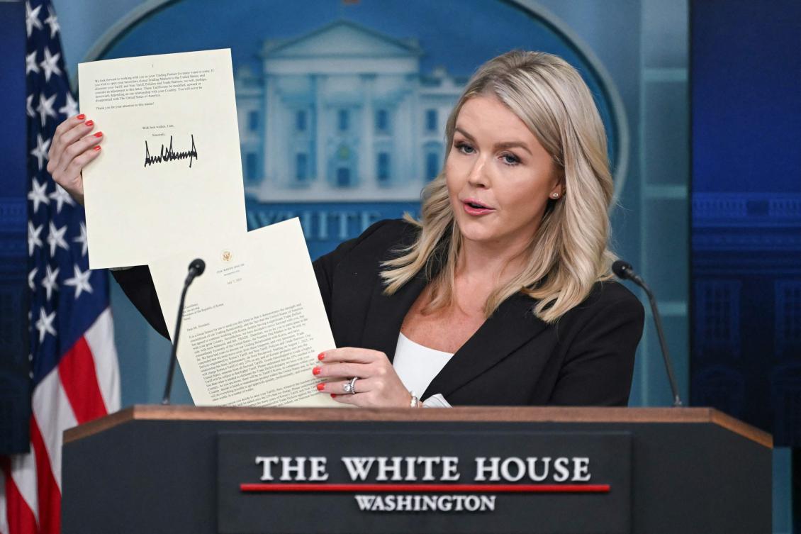 White House Press Secretary Karoline Leavitt holds a letter from US President Donald Trump addressed to South Korean President Lee Jae-myung informing Seoul of the 25 percent tariffs from August 1. (AFP)