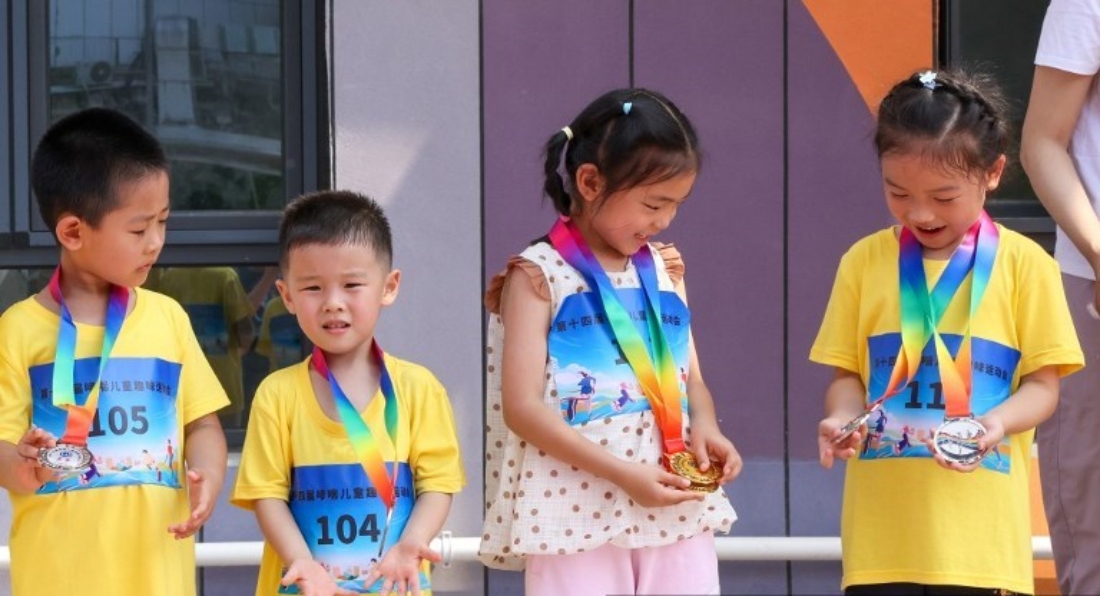 Children show their medals won at the competition in Beijing, China. (AFP)