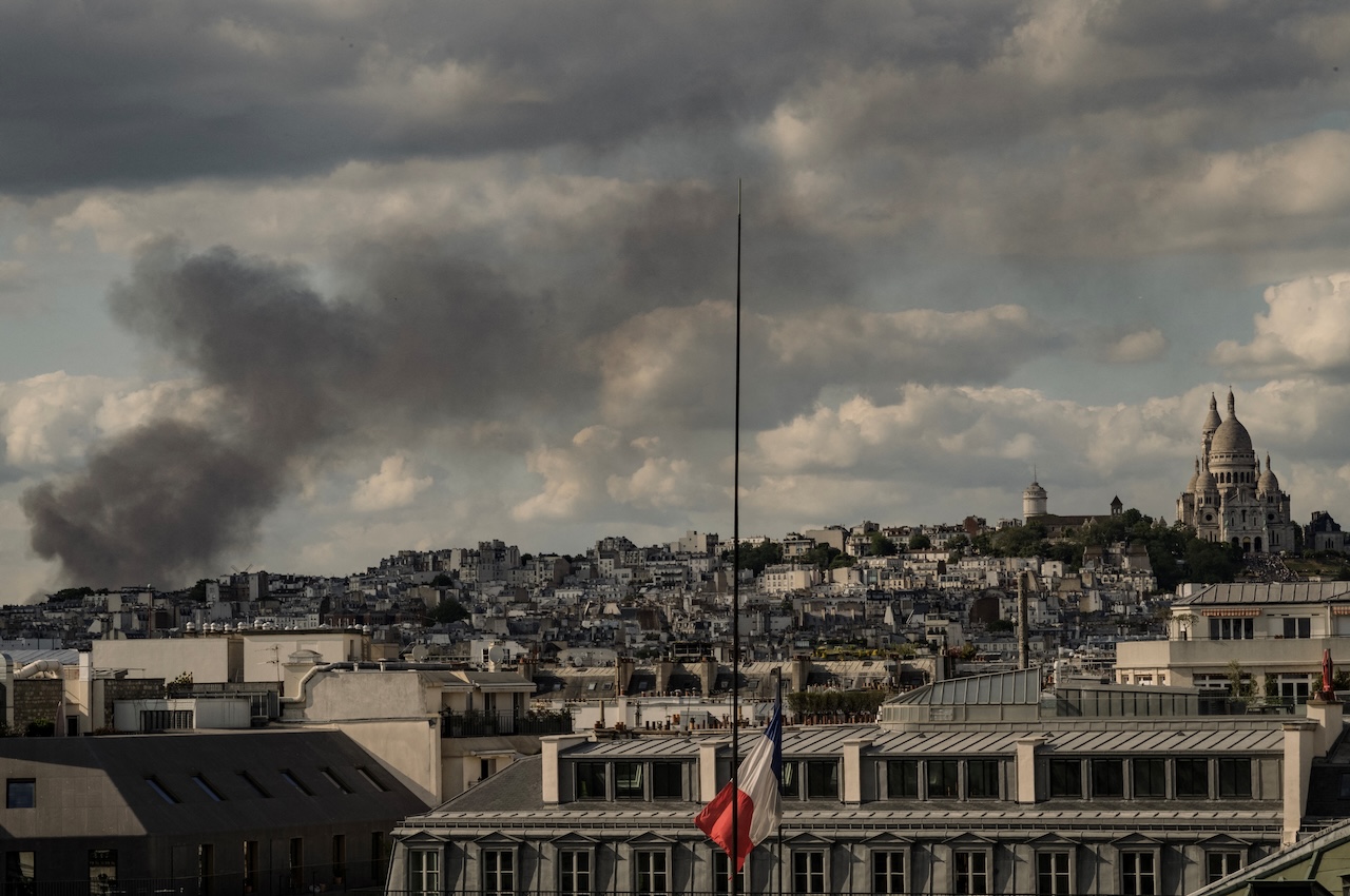 According to local media, two families were trapped by the fire on Saturday and took refuge in a flat on the top floor. (File/AFP)