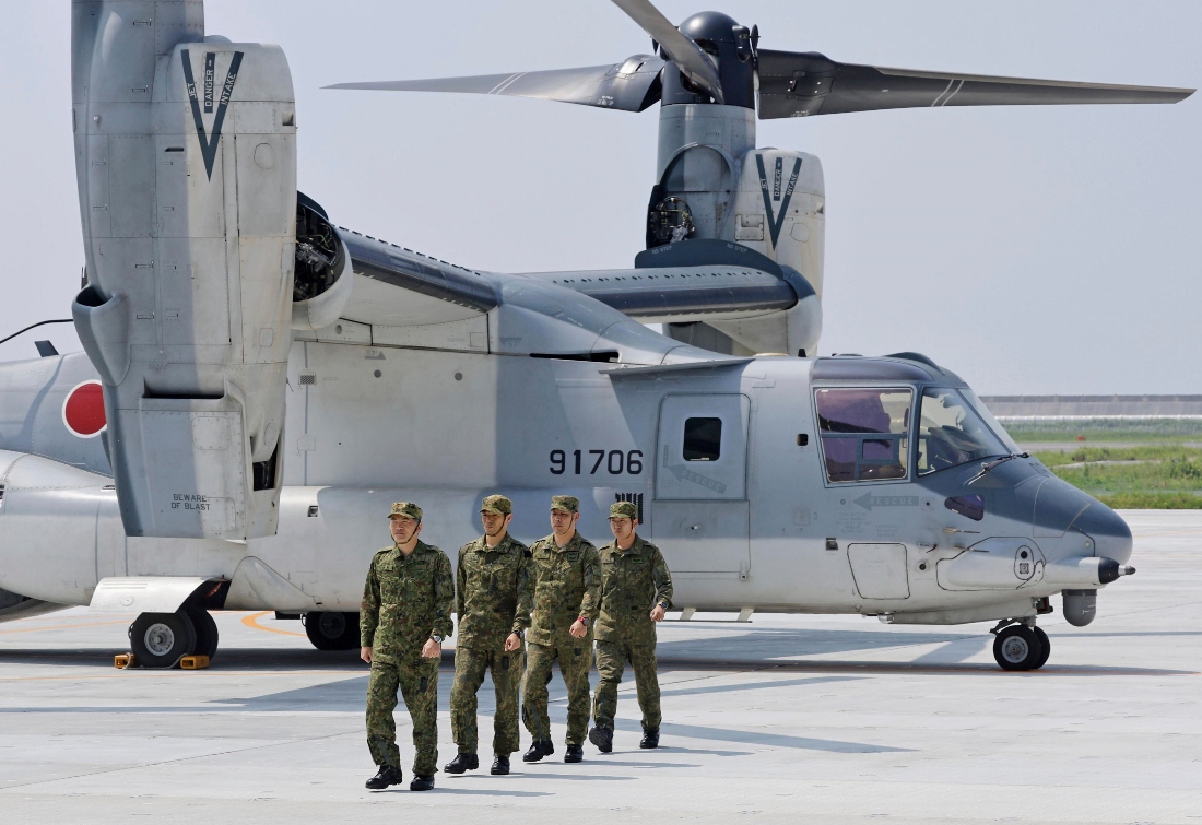 Members of Japan Ground Self-Defense Force disembark from a V-22 Osprey on the arrival at Camp Saga, Japan. (AP)