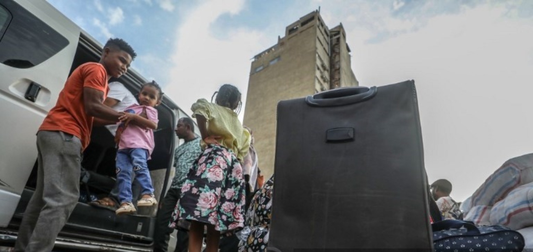 Sudanese who forced to flee and sought refuge in Egypt due to conflict, wait for buses at a station in Cairo, Egypt. (AFP)