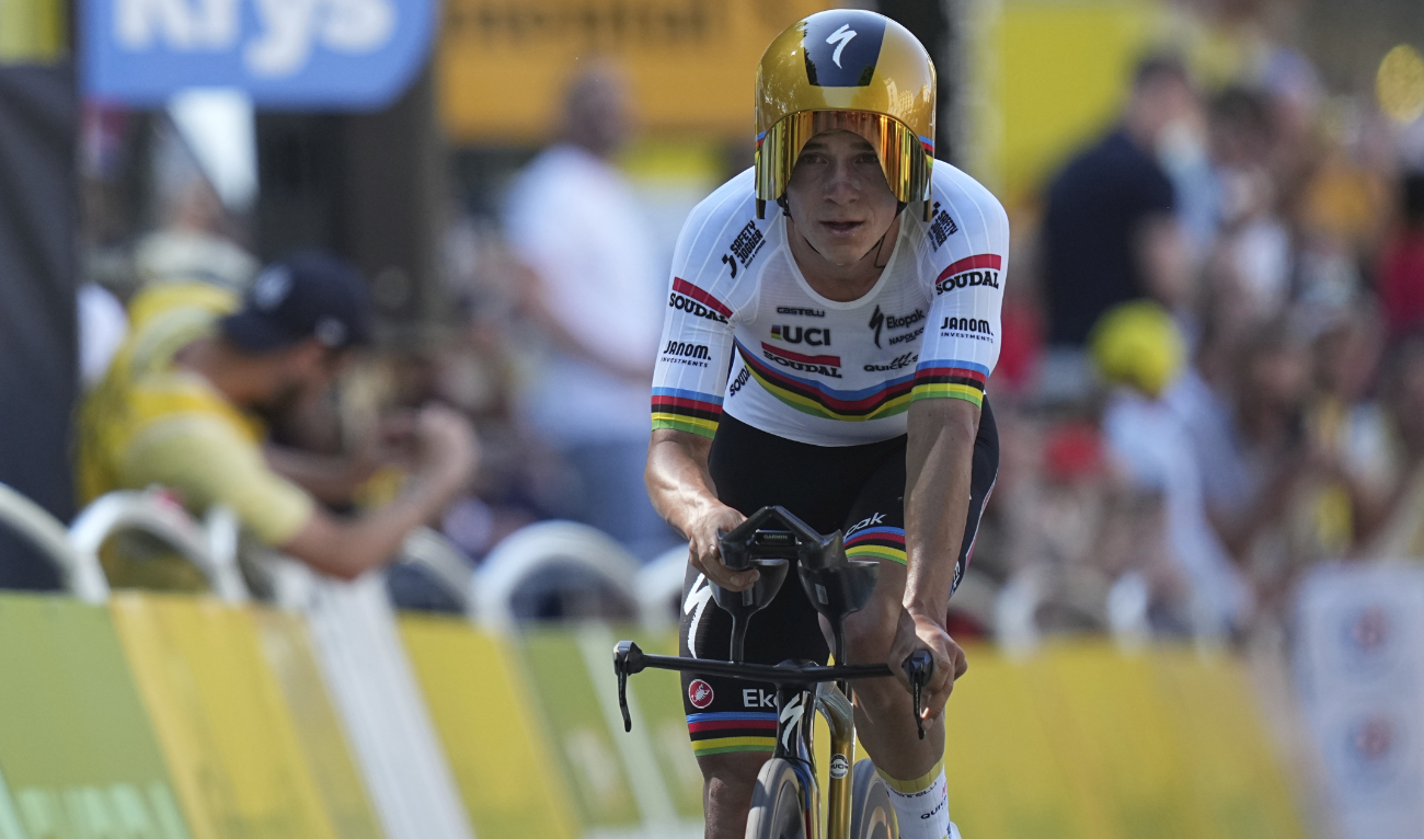 Belgium’s Remco Evenepoel crosses the finish line during the fifth stage of the Tour de France cycling race, an individual time-trial over 33 kilometers (20.5 miles) with start and finish in Caen, France, Wednesday. (AP)