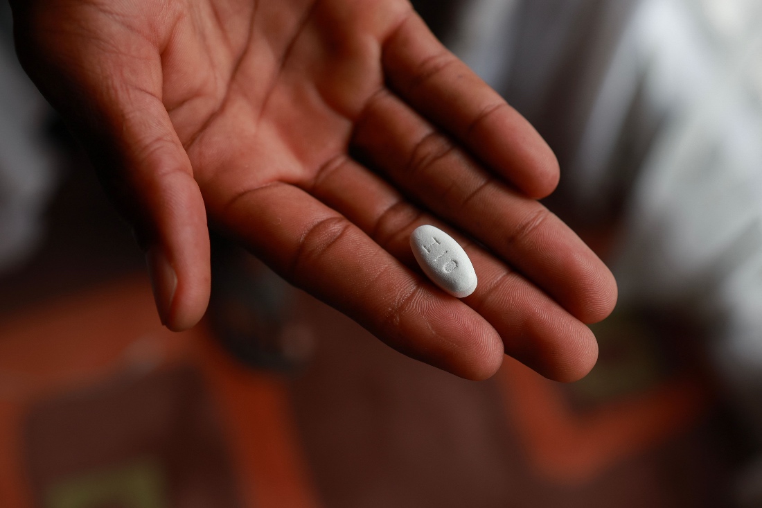 A patient shows a Vulante tablet, a medication used for the treatment of HIV infection in adults aged 18 years and older at his home in the town of Msogwaba, South Africa. (AP)
