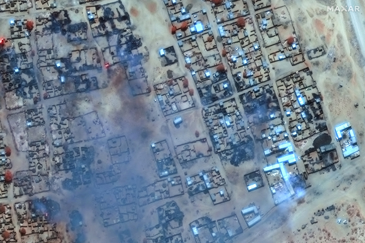 This handout image courtesy of Maxar Technologies released on April 17, 2025, shows smoke billowing and burned buildings in the Zamzam camp near the besieged Darfur city of El-Fasher. (AFP/File)