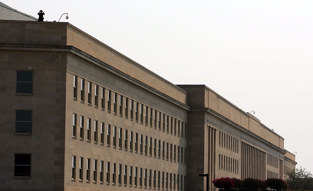A security officer stands watch on the roof of the Pentagon. (AFP/File)