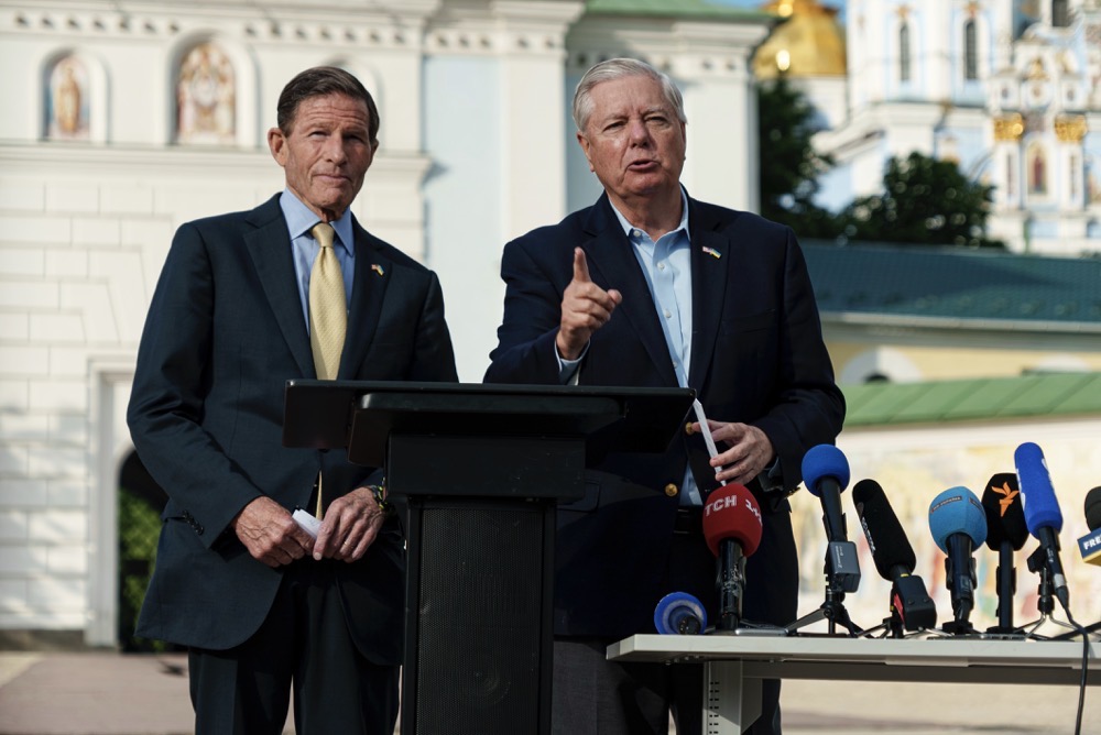 The bill backed by Republican Sen. Lindsey Graham, right, and Democratic Sen. Richard Blumenthal calls for a 500 percent tariff on goods imported from countries that continue to buy Russian oil. (AP/File)