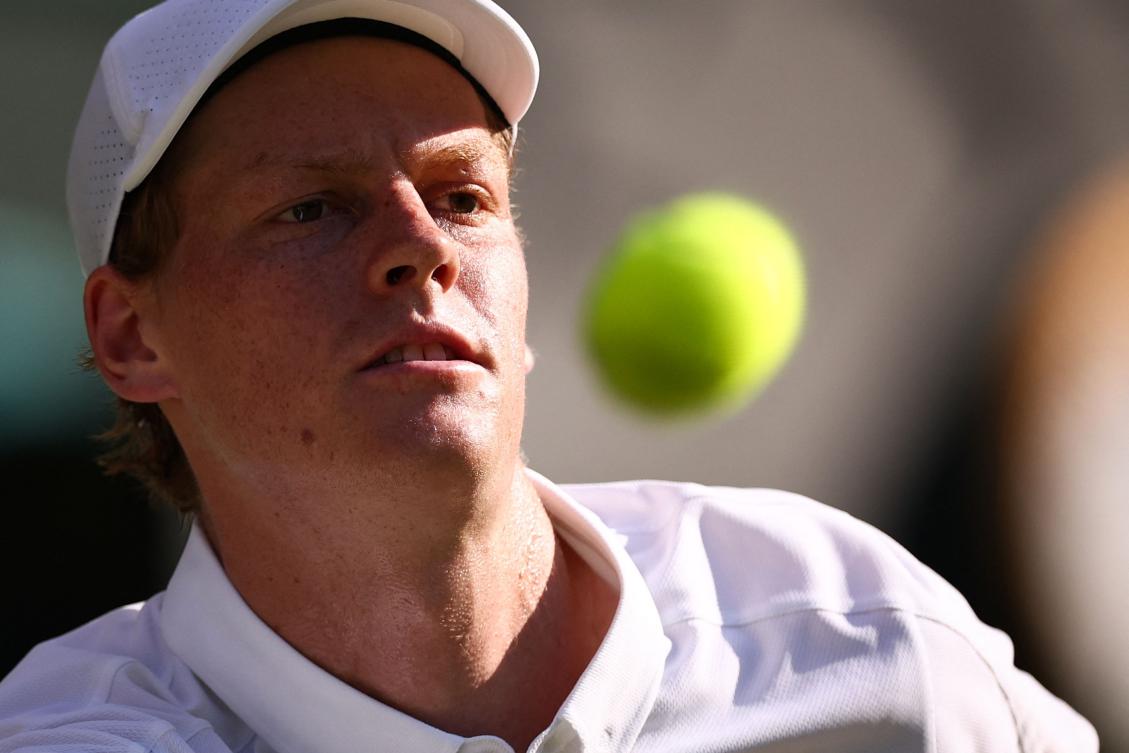 Italy's Jannik Sinner eyes the ball as he plays against Serbia's Novak Djokovic during their men's singles semi-final tennis match on the twelfth day of the 2025 Wimbledon Championships at The All England Lawn Tennis and Croquet Club in Wimbledon, southwest London, on July 11, 2025. (AFP)
