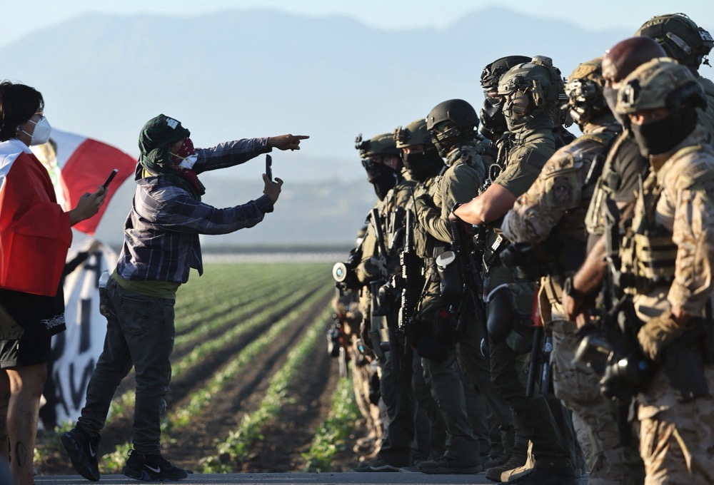 Authorities clad in military-style helmets and uniforms faced off with the demonstrators. (Getty Images/AFP)