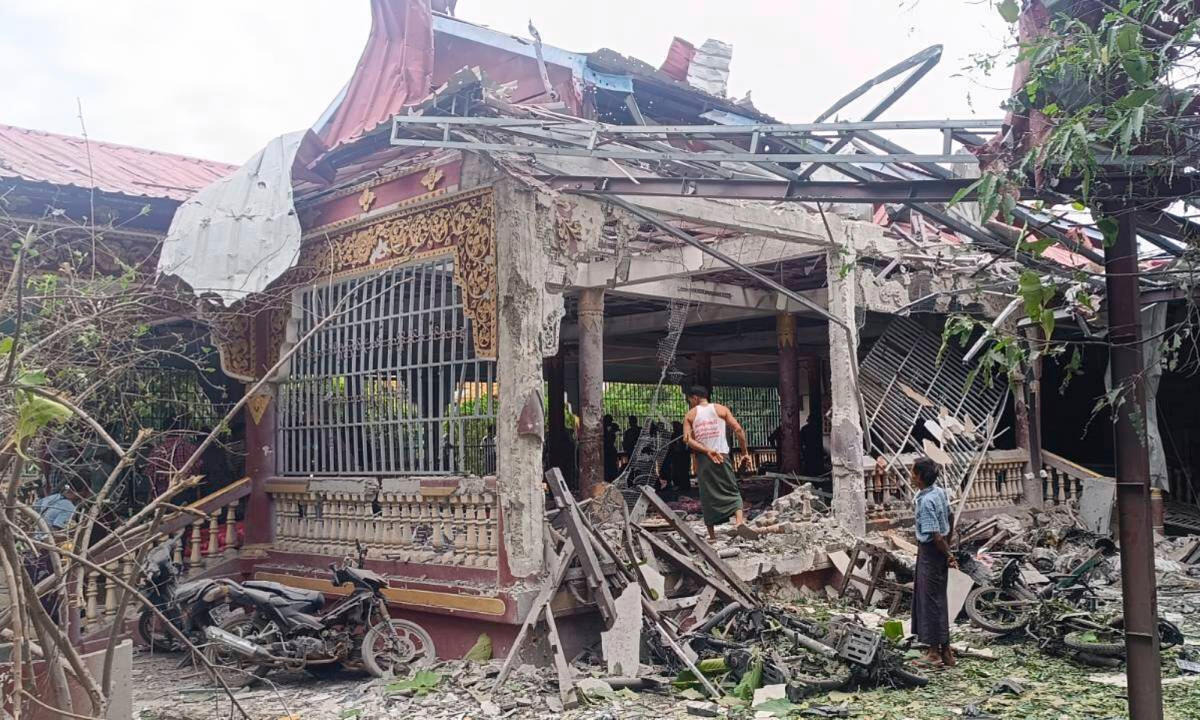 People check the debris at the building in a Buddhist monastery that was allegedly hit by the military’s airstrike in Sagaing township in Sagaing region, Myanmar on July 11, 2025. (UGC via AP)
