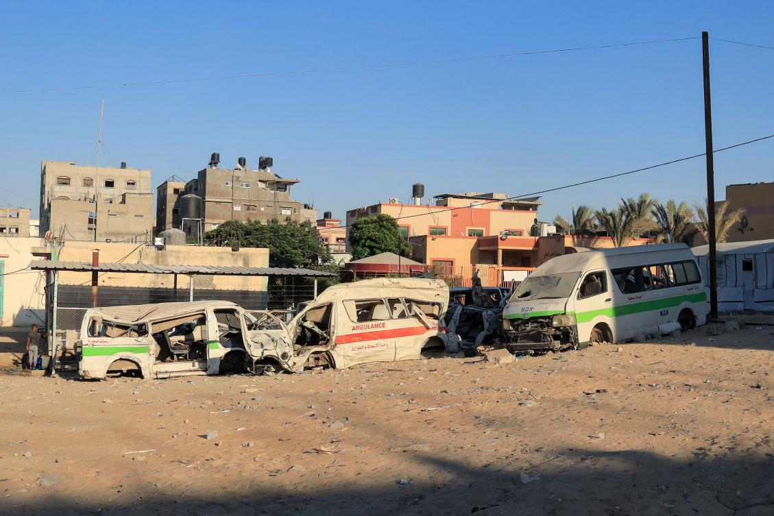 Heavily damaged ambulances lie outside the Nasser hospital in Khan Yunis on July 11, 2025. Gaza's health system has been at a point of near collapse for months, with nearly all hospitals and health facilities either out of service or only partly functional. Israel's drastic restrictions on the entry of goods and aid into Gaza since the start of the war in October 2023, has caused shortages of everything, including medicine, medical supplies, and fuel, which hospitals rely on to power their generators. (AFP)