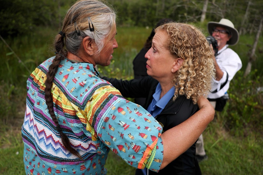 Rep. Debbie Wasserman Schultz (D-FL) hugs Betty Osceola, a member of the Miccosukee Tribe of Indians of Florida, after visiting "Alligator Alcatraz" at the Dade-Collier Training and Transition Airport on July 12, 2025, in Ochopee, Florida. (Getty Images/AFP)