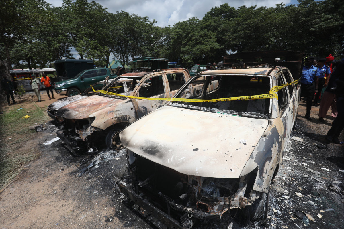 Burnt prison vehicles are seen in Abuja, Nigeria on July 6, 2022, after suspected Boko Haram gunmen attacked the Kuje Medium Prison. (AFP file photo)