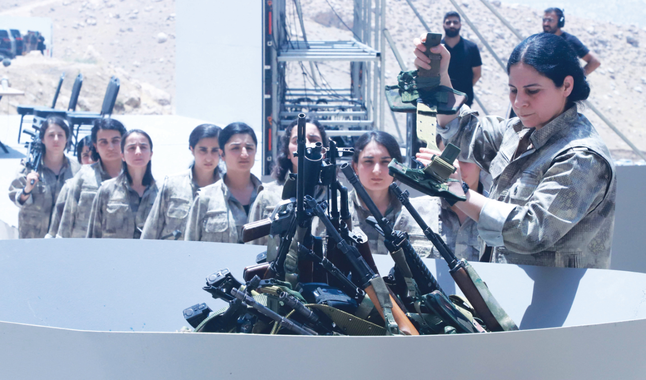 Thirty PKK fighters destroyed their weapons in Sulaimaniyah on Saturday, two months after the rebels ended their armed struggle against the Turkish state. (AFP)