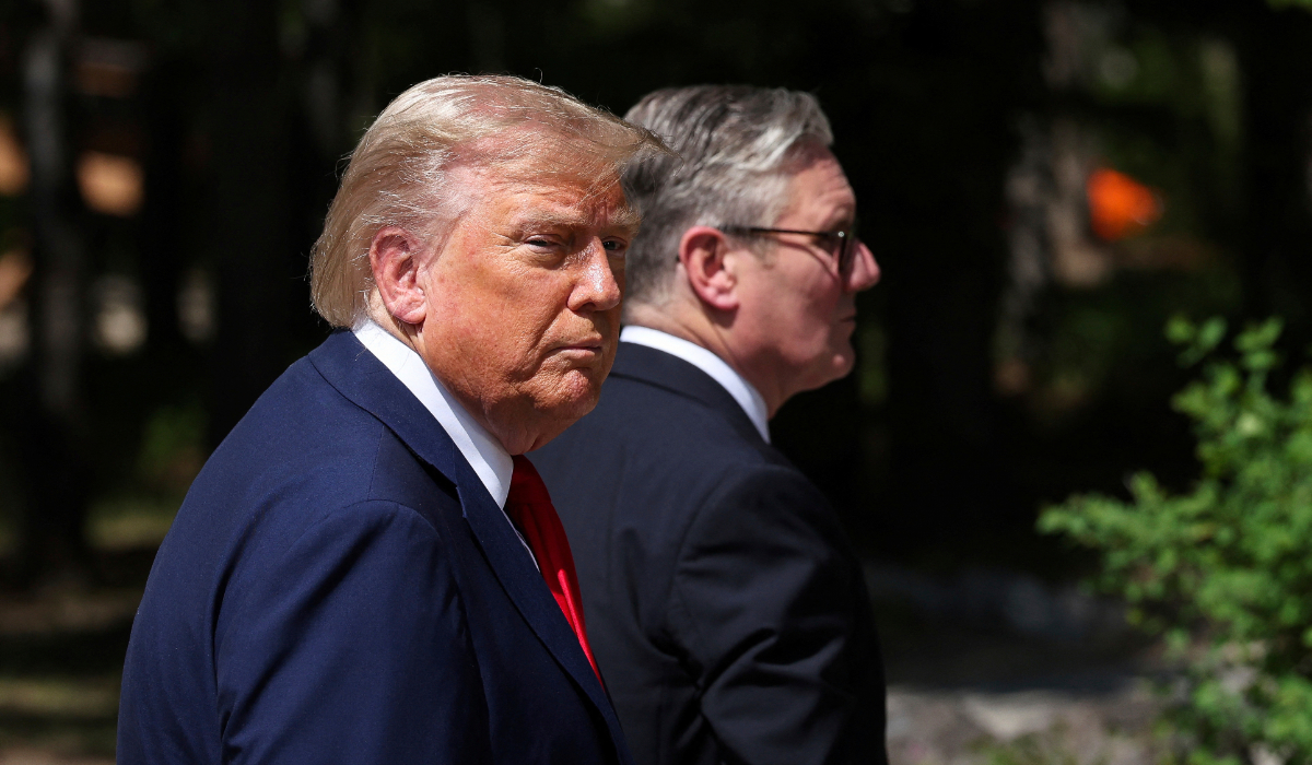 U.S. President Donald Trump, left, and Britain's Prime Minister Keir Starmer walk at the G7 summit, in Kananaskis, Alberta, Monday, June 16, 2025. (AP)