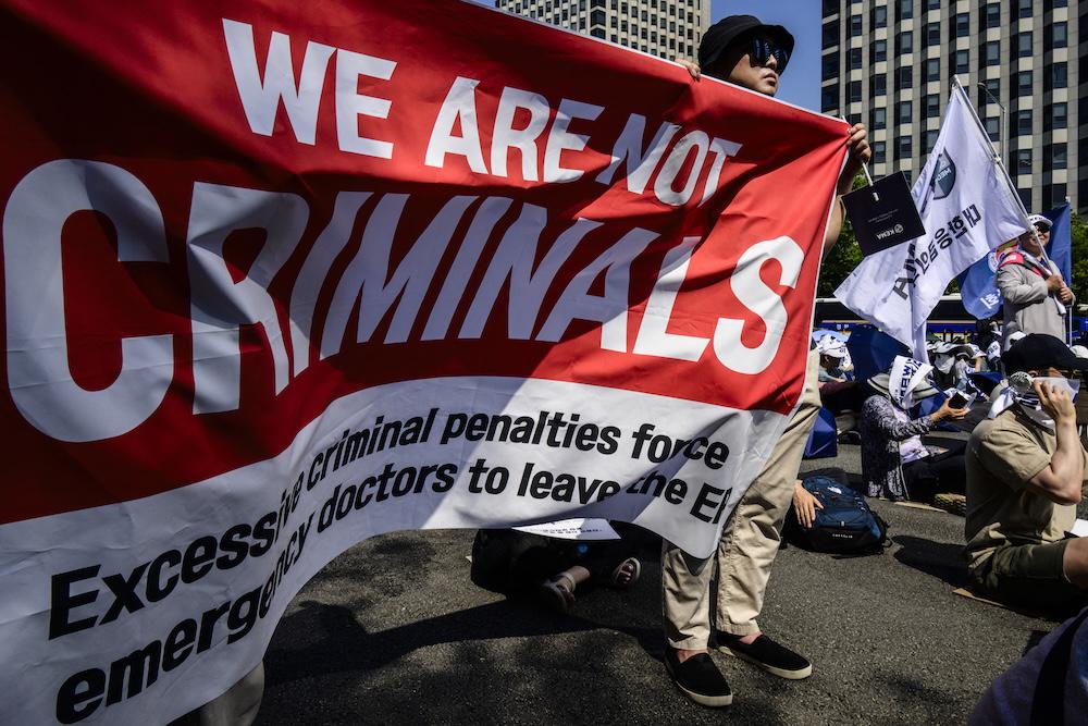 Members of The Korea Medical Association attend a rally in Seoul on June 18, 2024, as a months-long strike by junior medics drags on. (AFP)