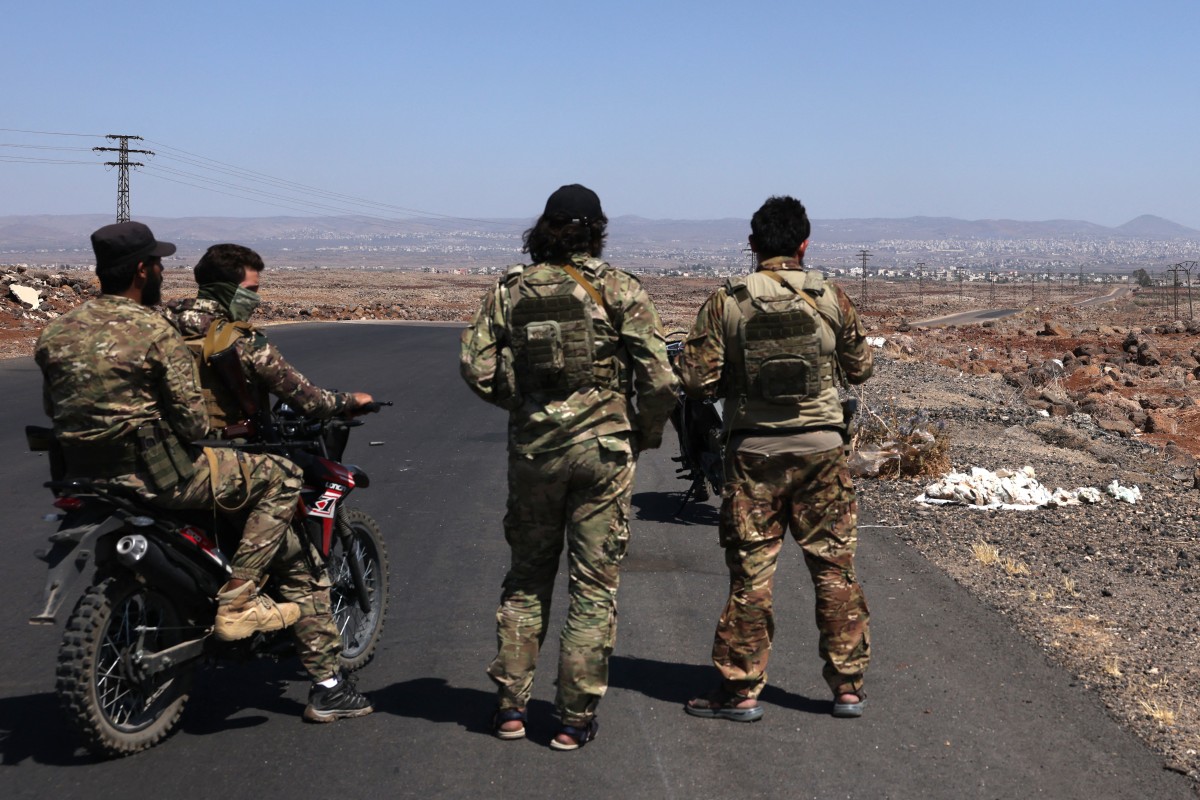 Syrian security forces take a position in the Mazraa area, near Sweida, following clashes between Bedouin tribes and local fighters in the predominantly Druze city, July 14, 2025. (AFP)