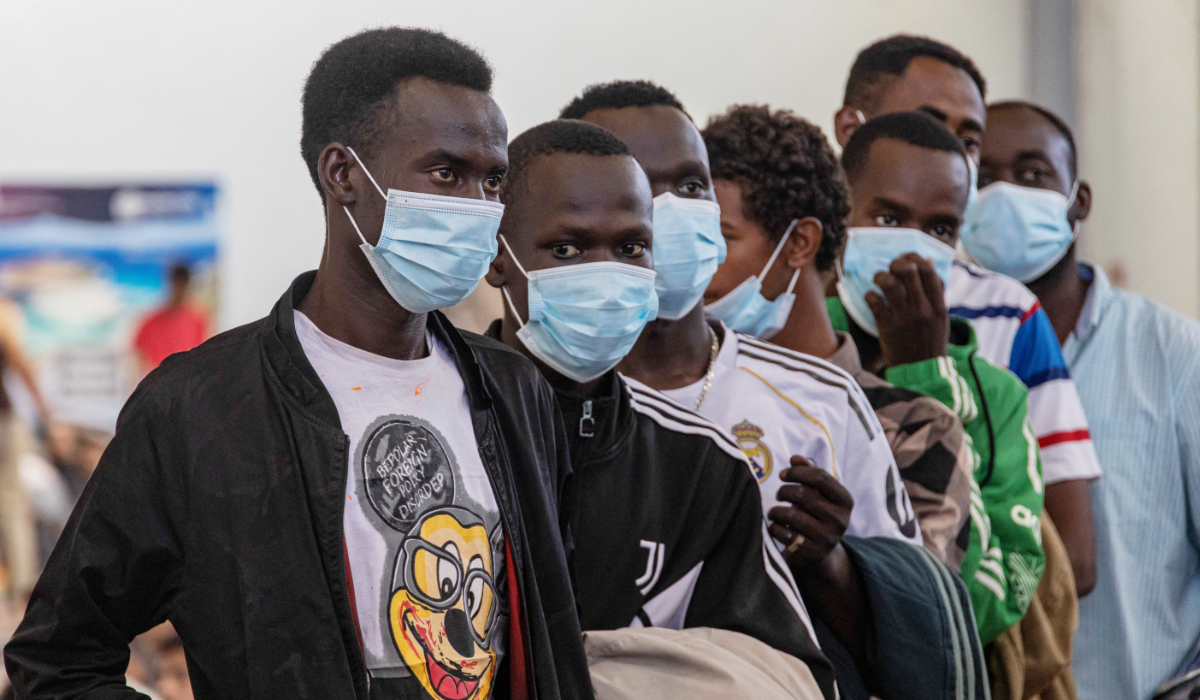 Newly-arrived migrants line up inside a municipal hall in the town of Agyia, on the island of Crete, Greece, July 13, 2025. (REUTERS)
