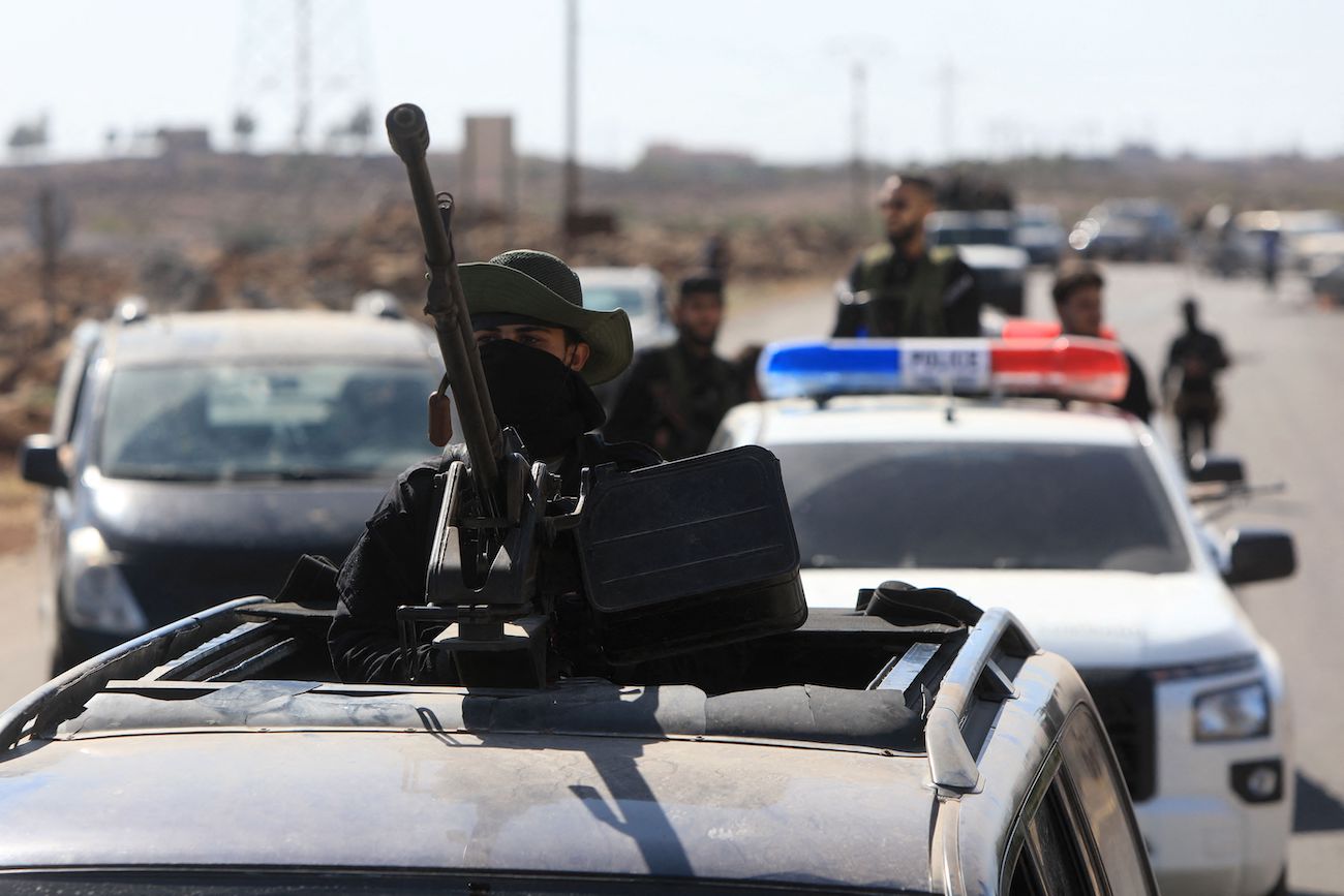 Syrian security forces take a position in the Mazraa area, near Sweida on July 14, 2025, following clashes between Bedouin tribes and local fighters in the predominantly Druze city. (AFP)