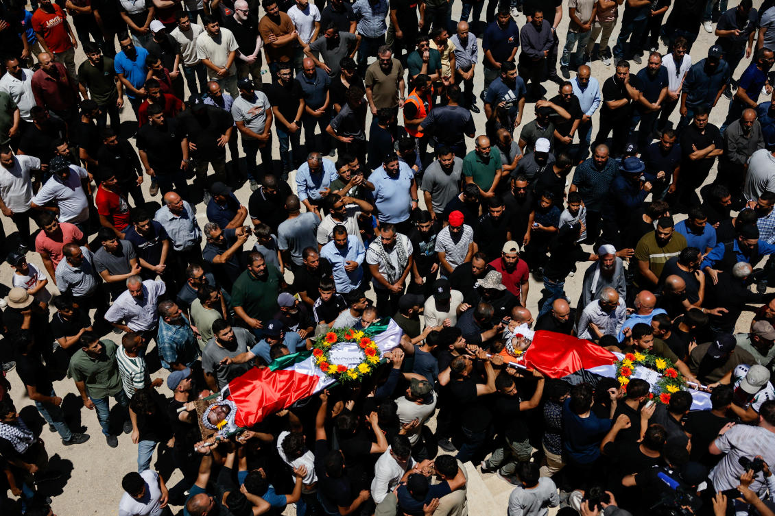 People carry the bodies of Sayfollah Kamel Musallet, a Palestinian-American man who was beaten to death by settlers, and Mohammad Al-Shalabi, a man who was shot dead by Israeli forces, according to the Palestinian Health Ministry, during their funeral near Ramallah, in the West Bank Jul. 13, 2025. (Reuters)