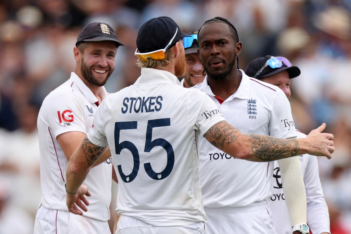 England’s Jofra Archer, right, celebrates with teammates after the dismissal of India’s Washington Sundar during the fifth day of the third cricket Test match between England and India at Lord's on Monday. (AP)