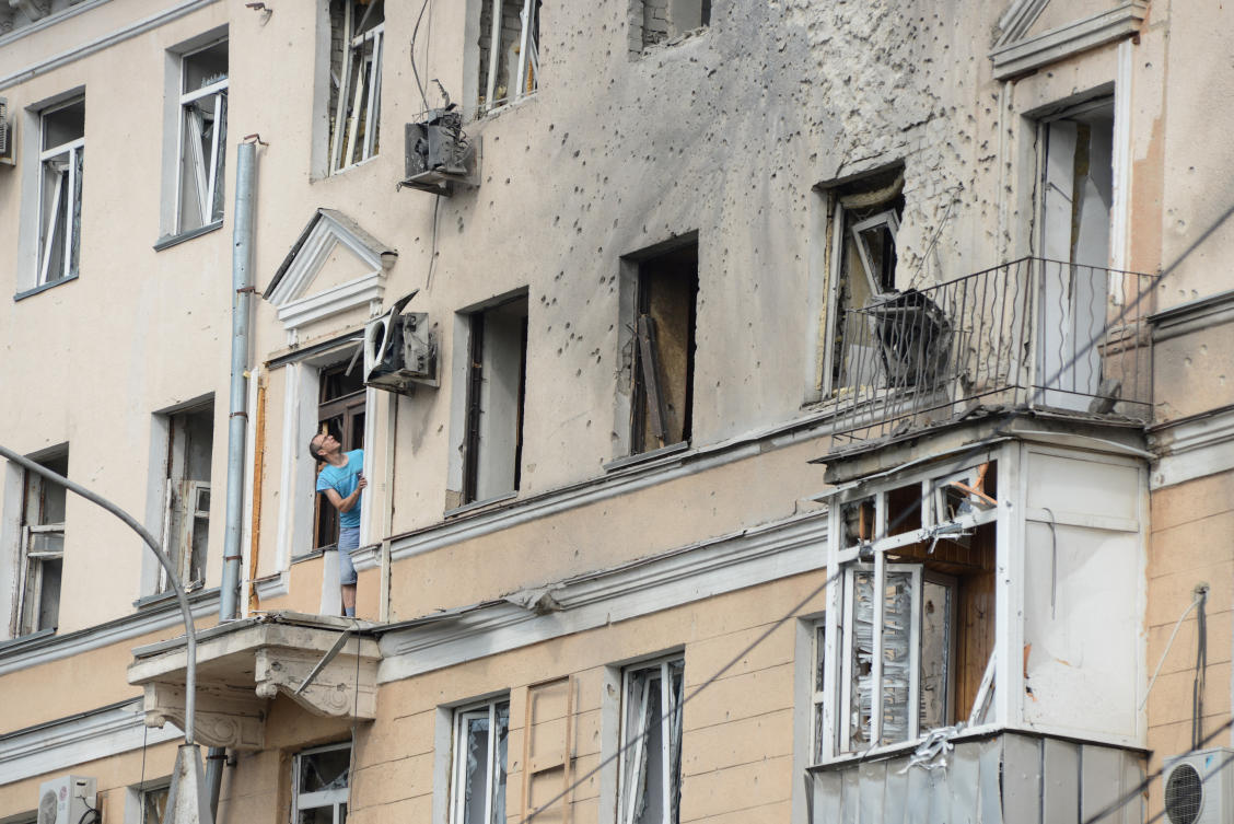A man looks out from a damaged apartment building following what local authorities said was a Ukrainian drone attack, amid the Russia-Ukraine conflict, in the town of Voronezh, Russia July 15, 2025. (Reuters)