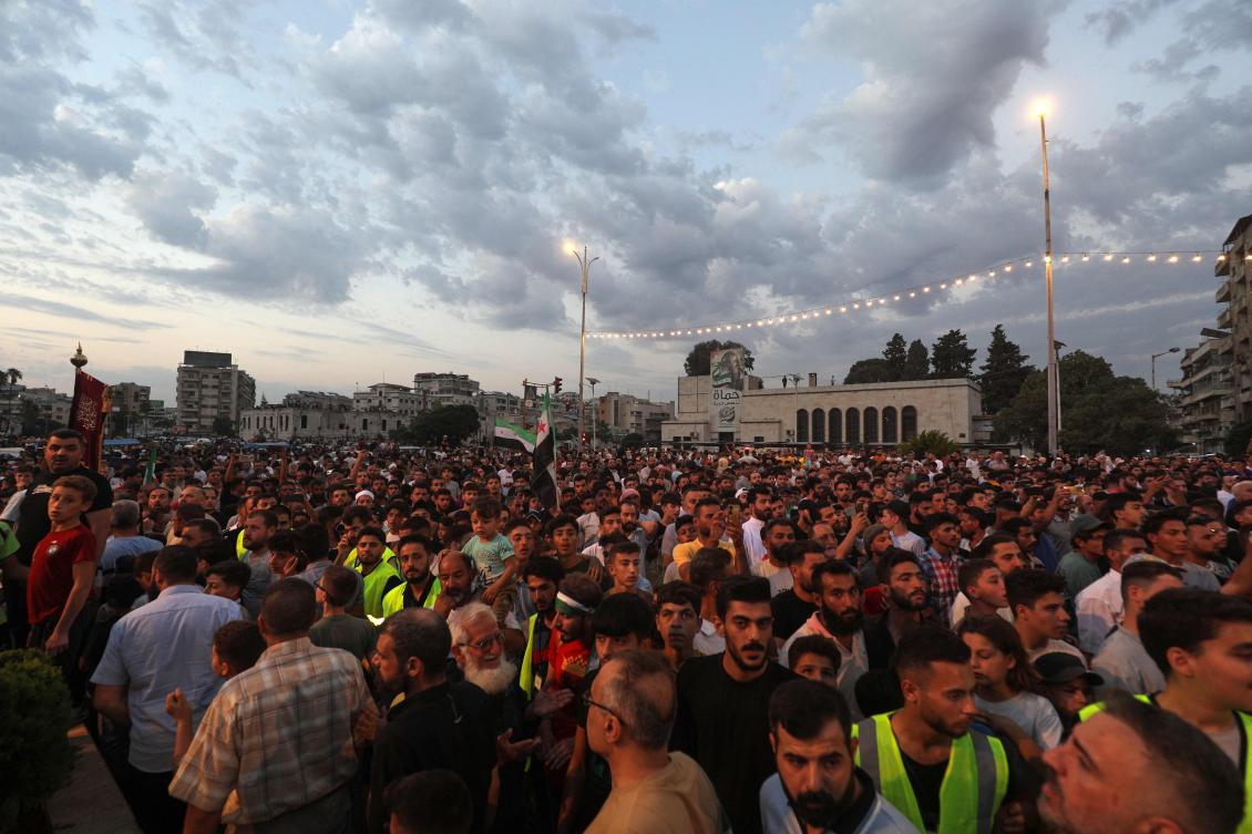 People take to the streets of Hama to protest against Israeli intervention in Syria, on July 16, 2025. . (AFP)