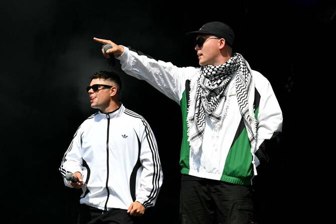 A town that hosts one of France's biggest pop festivals announced Wednesday that it was withdrawing its subsidy to the event because controversial Irish rappers Kneecap had been booked to play. (AFP/File)