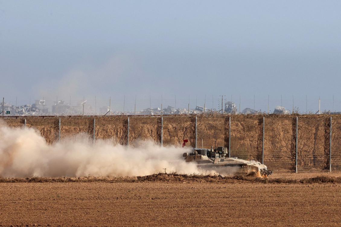This picture taken from a position at Israel's border with the Gaza Strip shows Israeli troops deployed in the bordering area of the besieged Palestinian territory on July 17, 2025. (AFP)